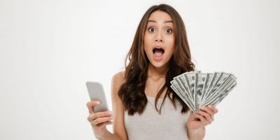 girl holding money