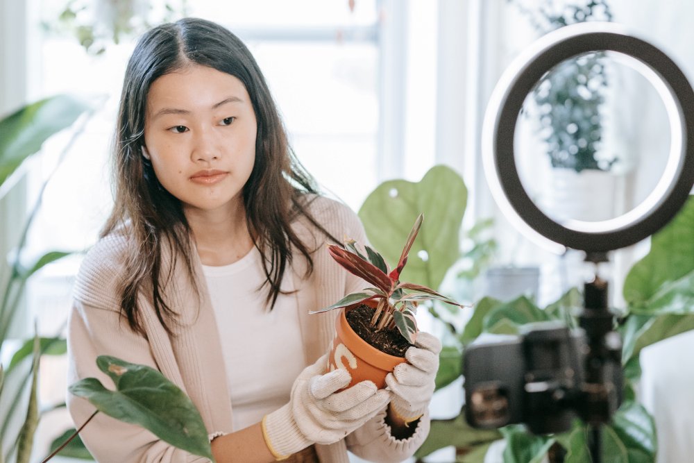 Woman with plants recording a video