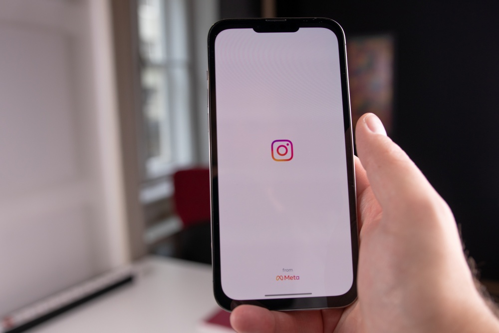 Instagram logo with white background on mobile phone